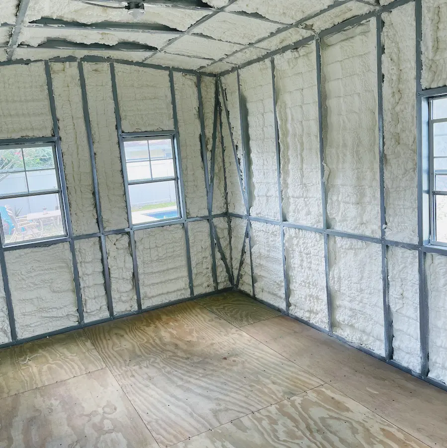 Closed-cell spray foam insulation applied to wall cavities in a residential project in Uxbridge